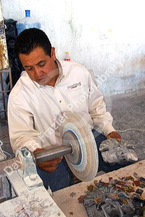 A Mexican artisan using obsidian to make masks near Teotihaucan in the State of Mexico, Mexico.