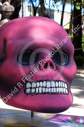 A painted skull is part of a public art display in celebration of Day of the Dead in Mexico City, Mexico.