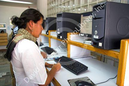 Female student doing research on a computer at the Central Library of the National Autonomous University of Mexico in Mexico City, Mexico.