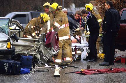 Fire and rescue officers on the scene of an automobile accident.