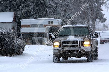 Four wheel drive truck driving on snow covered roads in Boise, Idaho.
