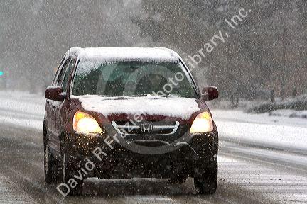 Automobile driving on a snowy day in Boise, Idaho.