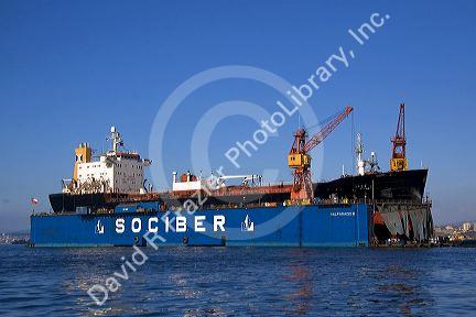Floating dry dock with container ship in the Port at Valparaiso, Chile.