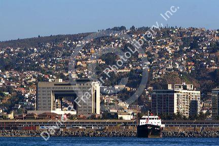 National Congress building and cargo ship in the Port at Valparaiso, Chile.