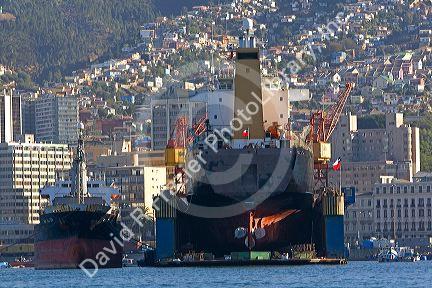 Floating dry dock with container ship in the Port at Valparaiso, Chile.