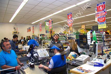 Customers in the check out line at a super market in El Calafate, Patagonia, Argentina.