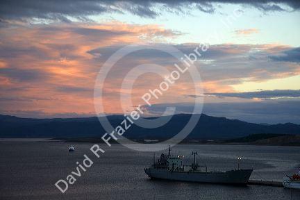 Ship docked at sunset in the bay at Ushuaia on the island of Tierra del Fuego, Argentina.