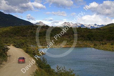 Car on a dirt road in the Tierra del Fuego National Park, Argentina.
