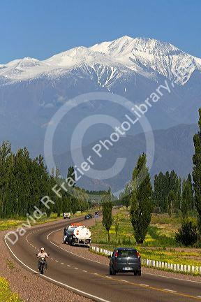 A view of the Andes Mountain Range with traffic on highway 7 near Mendoza, Argentina.