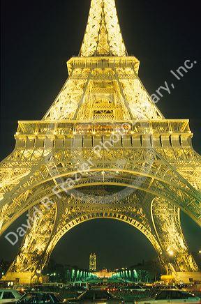 The Eiffel Tower lit up at night in Paris, France.