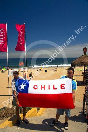 Souvenir flag of Chile being sold on the beach at Renaca on the Pacific Ocean in Chile.