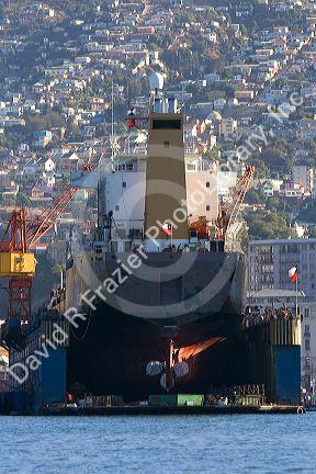 Floating dry dock with container ship in the Port at Valparaiso, Chile.