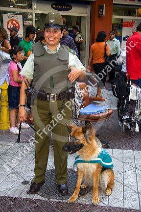 Female police officer with dog in Santiago, Chile.