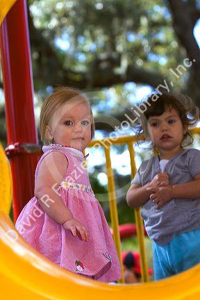 Young girls on playground equipment in Tampa, Florida.