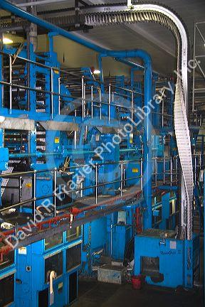 Newspapers being printed on a rotary printing press for the Houston Chronicle in Houston, Texas.