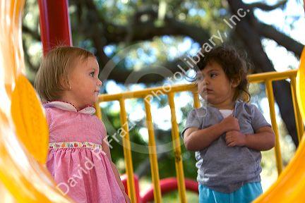 Young girls on playground equipment in Tampa, Florida.