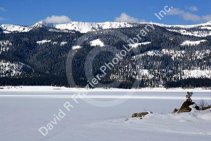 Cascade Lake covered in ice and snow in Cascade, Idaho.