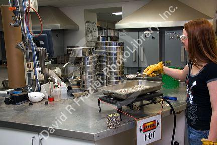 Technician working in a materials testing lab for the Ada County Highway District in Boise, Idaho.