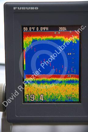 The screen of a fishfinder using sonar to measure water depth and detect fish in Lake Erie, Michigan.