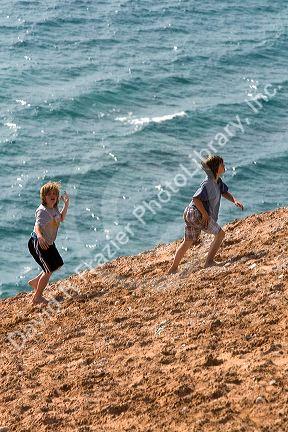Children play on the dunes of Lake Michigan in Sleeping Bear Dunes National Lakeshore located along the northwest coast of the Lower Peninsula of Michigan.