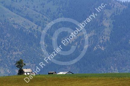 Small farmstead along U.S. Highway 26 east of Idaho Falls, Idaho.