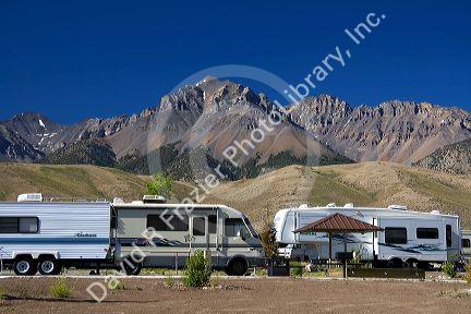 RV camping at the Joe T. Fallini BLM campground below the mountain peaks of the Lost River Range in central Idaho at Mackay Reservoir.