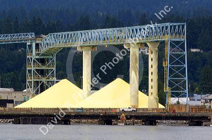 Sulfur recovered from hydrocarbons, stockpiled for shipment at Port Vancouver, British Columbia, Canada.