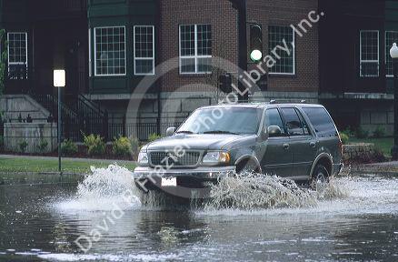 Car driving through a flooded intersection in Boise, Idaho.