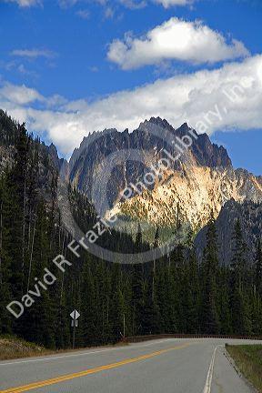 Washington State Highway 20 below a rocky mountain peak in the North Cascade Range, Washington.