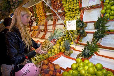 Spanish woman shopping at a Fruiteria in the city of Donostia-San Sebastian, Guipuzcoa, Basque Country, Northern Spain.