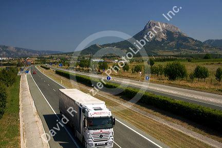 Long haul truck travels along the A-10 Autopista near the town of Etxarri-Aranatz, Navarre, northern Spain.