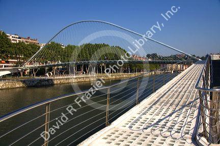 The Zubizuri Footbridge crossing the Nervion River in Bilbao, Biscay, Basque Country, northern Spain.