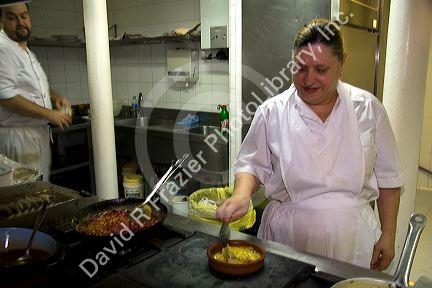 Cooks in the kitchen of a basque restaurant in the city of Bilbao, Biscay, Basque Country, northern Spain.