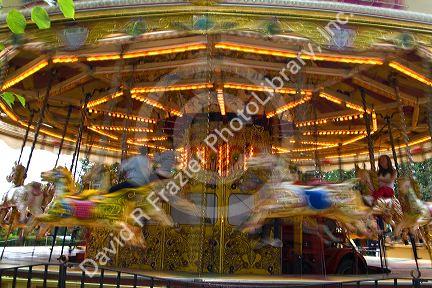 Merry-go-round in motion in the market town of Stratford-upon-Avon, Warwickshire, England.