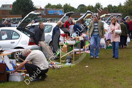 People browse a car boot sale in the market town of Banbury, Oxfordshire, England.