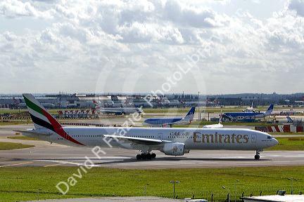 Emirates Boeing 777 airliner at the London Heathrow Airport, England, United Kingdom.