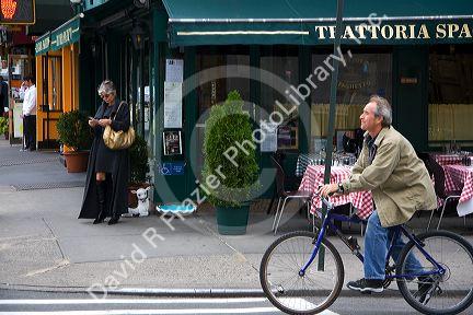 Bicyclist on 4th and 6th Avenues in lower Manhattan, New York City, New York, USA.