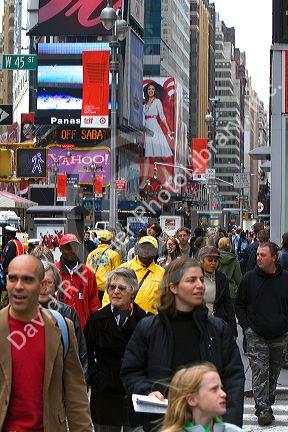 Pedestrians crossing the street in Times Square, Manhattan, New York City, New York, USA.