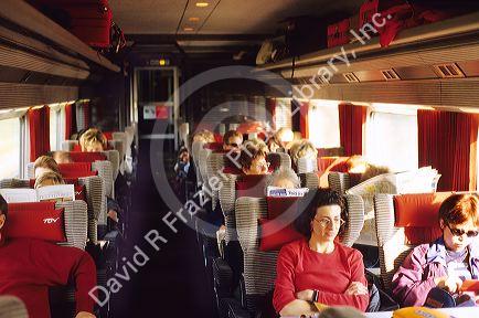 Passengers ride on a TGV train in France.