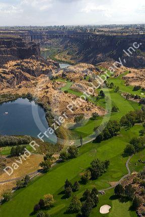 Blue Lakes Country Club golf course and the Perrine Bridge in the Snake River Canyon at Twin Falls, Idaho, USA.