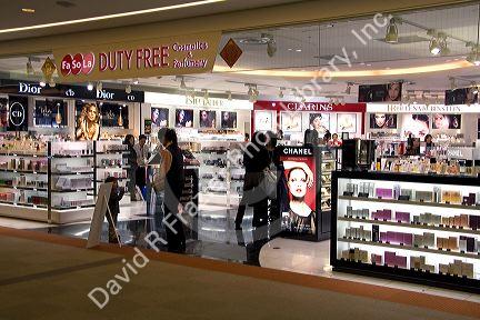 Travelers shop at a duty free store in the Narita International Airport, Tokyo, Japan.