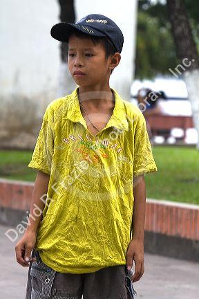 Vietnamese boy playing games on the street in Ho Chi Minh City, Vietnam.
