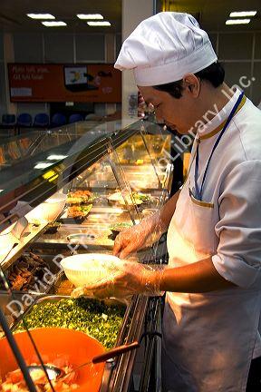 Chef making Pho, Vietnamese rice noodle soup in the Tan Son Nhat International Airport serving Ho Chi Minh City, Vietnam.