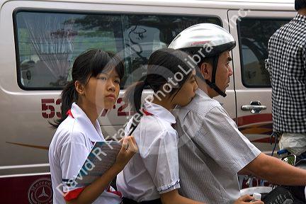 Vietnamese family ride motorbikes in Ho Chi Minh City, Vietnam.