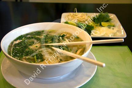 A bowl of Pho, Vietnamese rice noodle soup at a restaurant in Ho Chi Minh City, Vietnam.