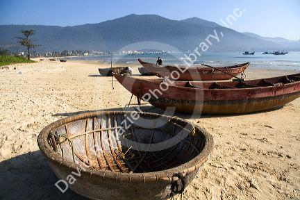 Woven boats and baskets on China Beach near the port city of Da Nang, Vietnam.