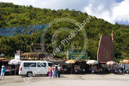 Vendors selling goods at the provincial border marker of Da Nang and the Thua Thien-Hue Province in Vietnam.
