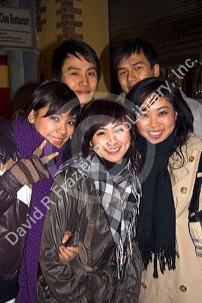 Young Vietnamese friends celebrate the Lunar New Year in Hanoi, Vietnam.