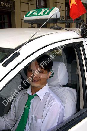 Vietnamese taxi cab driver in Ho Chi Minh City, Vietnam.