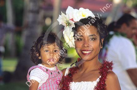Hawaiian woman holding her daughter.